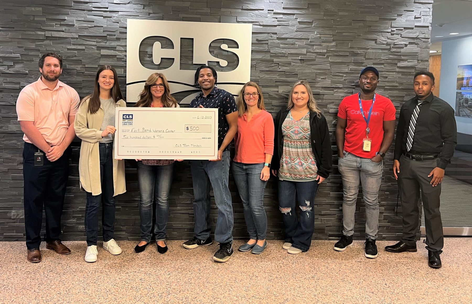 Donation, Contract Land Staff, Fundraiser, Employee News, CLS, News, Team gathered to offer donation to Fort Bend Women's Center